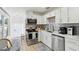 Bright kitchen features stainless steel appliances, white cabinets, and a breakfast nook at 3131 W Fielder St, Tampa, FL 33611