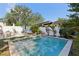 Private pool surrounded by tropical plants, with an outdoor dining set at 3131 W Fielder St, Tampa, FL 33611