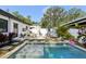 Secluded backyard pool with an outdoor dining area, perfect for entertaining at 3131 W Fielder St, Tampa, FL 33611