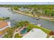 Stunning waterfront property features a private pool, lush landscaping, and direct access to the serene canal at 3901 Pompano Se Dr, St Petersburg, FL 33705
