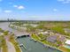 Aerial view of waterfront home with a lush yard, and a boat dock on a canal at 3901 Pompano Se Dr, St Petersburg, FL 33705