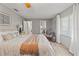 Bright bedroom with natural light, with wood-look flooring at 3901 Pompano Se Dr, St Petersburg, FL 33705