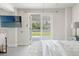 Bedroom features a ceiling fan, french doors leading to the outside, and stylish furnishings at 3901 Pompano Se Dr, St Petersburg, FL 33705