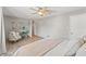 Light and airy bedroom with wood floors and neutral decor at 3901 Pompano Se Dr, St Petersburg, FL 33705