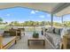 Covered deck with comfortable seating offering tranquil waterfront views at 3901 Pompano Se Dr, St Petersburg, FL 33705