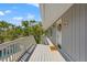 Inviting home exterior with a long, covered porch leading to a front door and featuring pool views at 3901 Pompano Se Dr, St Petersburg, FL 33705