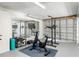 Bright gym with workout equipment, including exercise bike, weights, and wall-mounted mirror at 3901 Pompano Se Dr, St Petersburg, FL 33705