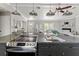Open-concept kitchen boasts granite counters, stainless appliances, and flows into a living area at 3901 Pompano Se Dr, St Petersburg, FL 33705