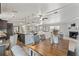 Spacious open-concept living area with eat-in dining and modern kitchen with wood-look flooring at 3901 Pompano Se Dr, St Petersburg, FL 33705