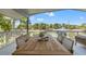 Spacious outdoor patio with dining table and scenic waterfront views at 3901 Pompano Se Dr, St Petersburg, FL 33705