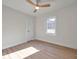 A bright, clean room offers a ceiling fan, wood floors, and simple charm at 400 38Th Ne Ave, St Petersburg, FL 33703