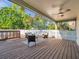 An inviting covered patio includes comfortable seating to enjoy the backyard view and sunshine at 400 38Th Ne Ave, St Petersburg, FL 33703