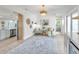 Bright, open living room with a cozy rug and comfortable seating arrangement at 400 38Th Ne Ave, St Petersburg, FL 33703