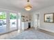Cozy living space with wet bar, mini-fridge, and sliding glass doors to the back deck at 400 38Th Ne Ave, St Petersburg, FL 33703
