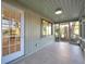 Covered porch with tile flooring, creating seamless indoor-outdoor transition at 400 38Th Ne Ave, St Petersburg, FL 33703