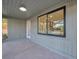 Enclosed porch with tile floors and wall paneling offers indoor-outdoor living space at 400 38Th Ne Ave, St Petersburg, FL 33703