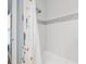 Cozy bathroom with a shower and tub combination and white subway tile at 4121 Highland Park Cir, Lutz, FL 33558