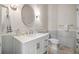 Elegant powder room features a marble vanity, decorative mirror, and tiled walls at 4121 Highland Park Cir, Lutz, FL 33558