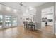 Open concept living room with views of the pool and access to the kitchen and dining areas at 4121 Highland Park Cir, Lutz, FL 33558