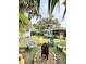 An inviting backyard features a fire pit surrounded by colorful chairs, with a studio in the background at 4501 26Th S Ave, St Petersburg, FL 33711