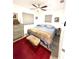 Cozy bedroom with two windows, a ceiling fan, and neutral colored walls at 4501 26Th S Ave, St Petersburg, FL 33711