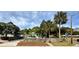 Inviting home with a fenced yard, lush palm trees, and a well-maintained front garden at 4501 26Th S Ave, St Petersburg, FL 33711