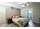 Bedroom featuring a ceiling fan and ensuite access at 4610 Courtland St, Tampa, FL 33610
