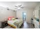 Comfortable bedroom with ceiling fan and an ensuite bathroom at 4610 Courtland St, Tampa, FL 33610