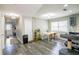 Bright dining area adjacent to the kitchen, featuring a table and chairs under a modern lighting fixture at 4610 Courtland St, Tampa, FL 33610
