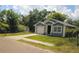 Charming single-Gathering home with a well-maintained lawn and attached one car garage at 4610 Courtland St, Tampa, FL 33610