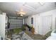 Spacious garage with ample storage, shelving, and access to the home's exterior at 4610 Courtland St, Tampa, FL 33610