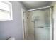 Tiled shower with sliding glass doors at 4610 Courtland St, Tampa, FL 33610