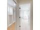 Elegant bathroom with soaking tub, tiled floors, and white walk-in closet at 5051 Gevalia Dr, Brooksville, FL 34604
