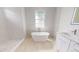 Modern bathroom featuring a soaking tub and walk-in shower at 5051 Gevalia Dr, Brooksville, FL 34604