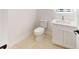 Powder room featuring a modern vanity with quartz countertop and neutral colored flooring at 5051 Gevalia Dr, Brooksville, FL 34604