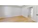 Empty bedroom featuring light hardwood floors and white walls at 5051 Gevalia Dr, Brooksville, FL 34604