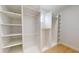 Walk-in closet with installed shelves and storage at 5051 Gevalia Dr, Brooksville, FL 34604
