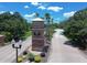 Aerial view of the entrance to the community with brick pillars and landscaping at 5051 Gevalia Dr, Brooksville, FL 34604