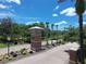View of the entrance to the community with brick pillars and meticulously landscaped surroundings at 5051 Gevalia Dr, Brooksville, FL 34604