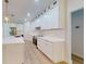 Spacious kitchen with stainless steel appliances, white cabinets, and modern finishes at 5051 Gevalia Dr, Brooksville, FL 34604