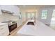 Gourmet kitchen with stainless steel oven, quartz countertops and a large island with sink at 5051 Gevalia Dr, Brooksville, FL 34604