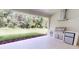 Covered outdoor kitchen featuring built-in grill and mini-fridge at 5051 Gevalia Dr, Brooksville, FL 34604