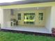 Covered outdoor kitchen with built-in grill and stainless steel features, perfect for entertaining guests at 5051 Gevalia Dr, Brooksville, FL 34604