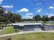 Exterior aerial view of pro shop with ramp, golf course and green space in the background at 5051 Gevalia Dr, Brooksville, FL 34604