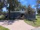 Exterior view of the pro shop, featuring a brick walkway and welcoming entrance at 5051 Gevalia Dr, Brooksville, FL 34604