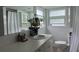 Clean bathroom featuring a vanity, mirror, updated sink and a shower curtain at 5201 18Th S Ave, Gulfport, FL 33707