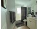 Bright bathroom featuring a shower-tub combo with modern fixtures and a neutral color palette at 5201 18Th S Ave, Gulfport, FL 33707