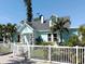 Charming coastal home with a picket fence and lush tropical landscaping at 5201 18Th S Ave, Gulfport, FL 33707