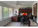 Comfortable home office with built-in desk and storage, natural light, and an ergonomic chair at 5201 18Th S Ave, Gulfport, FL 33707