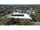 Elevated aerial view showing U-shaped apartment building set amongst a residential neighborhood and mature trees at 525 9Th N Ave # 2, St Petersburg, FL 33701